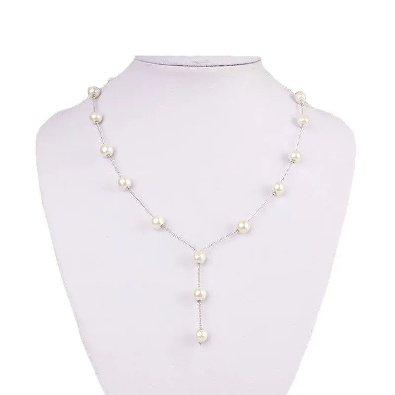 4-Piece Gold Jewelry Set – Elegant Imitation Pearl Necklace, Earrings & Bracelet with Tassel Details