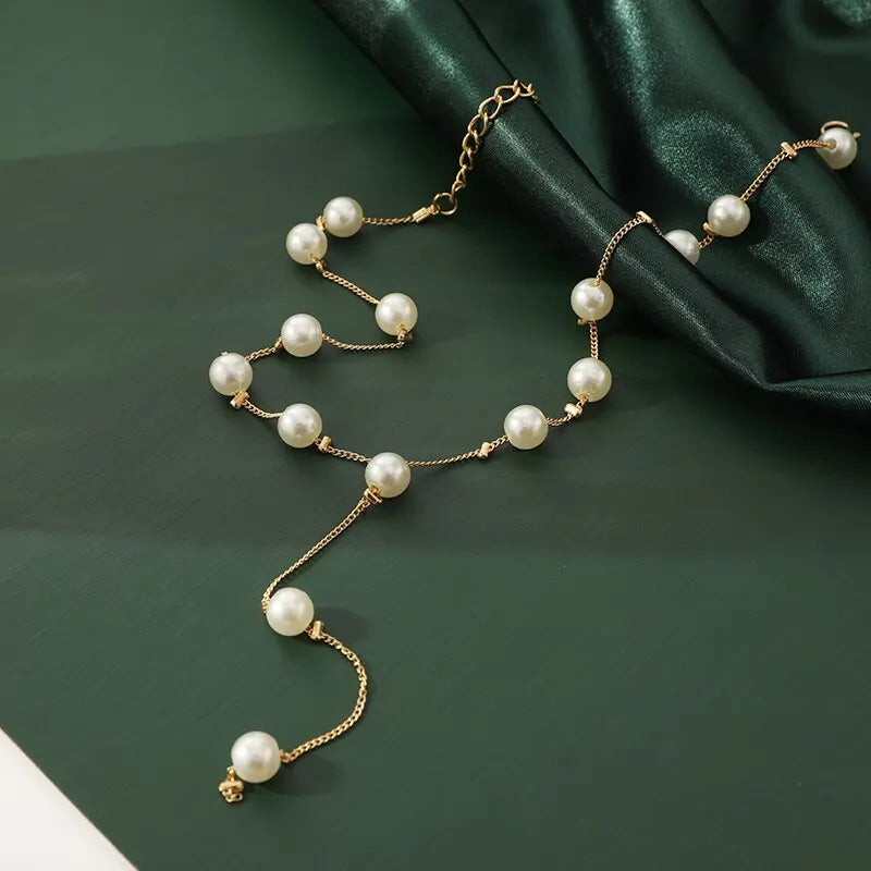 4-Piece Gold Jewelry Set – Elegant Imitation Pearl Necklace, Earrings & Bracelet with Tassel Details