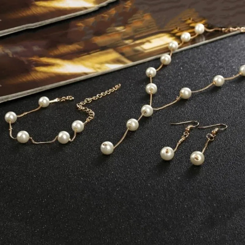 4-Piece Gold Jewelry Set – Elegant Imitation Pearl Necklace, Earrings & Bracelet with Tassel Details