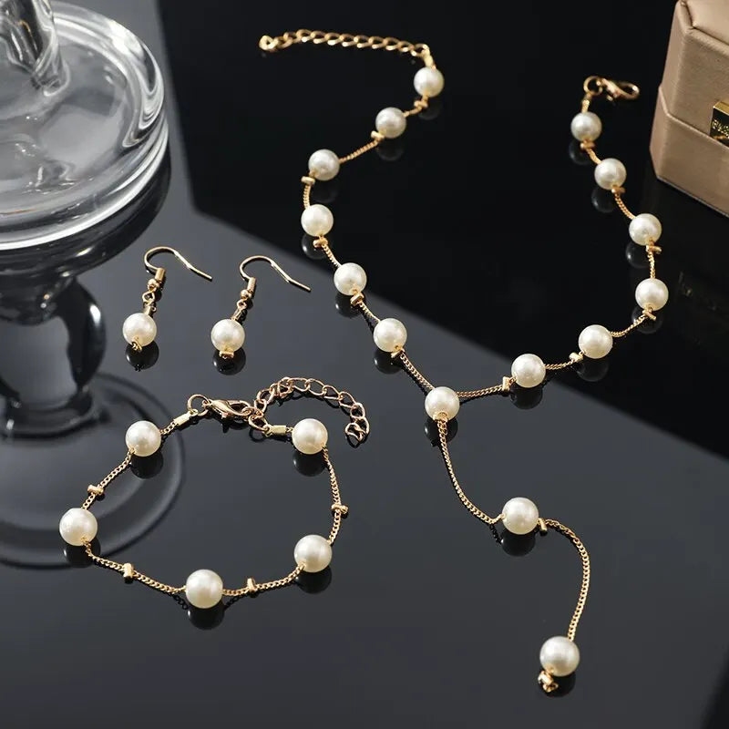 4-Piece Gold Jewelry Set – Elegant Imitation Pearl Necklace, Earrings & Bracelet with Tassel Details
